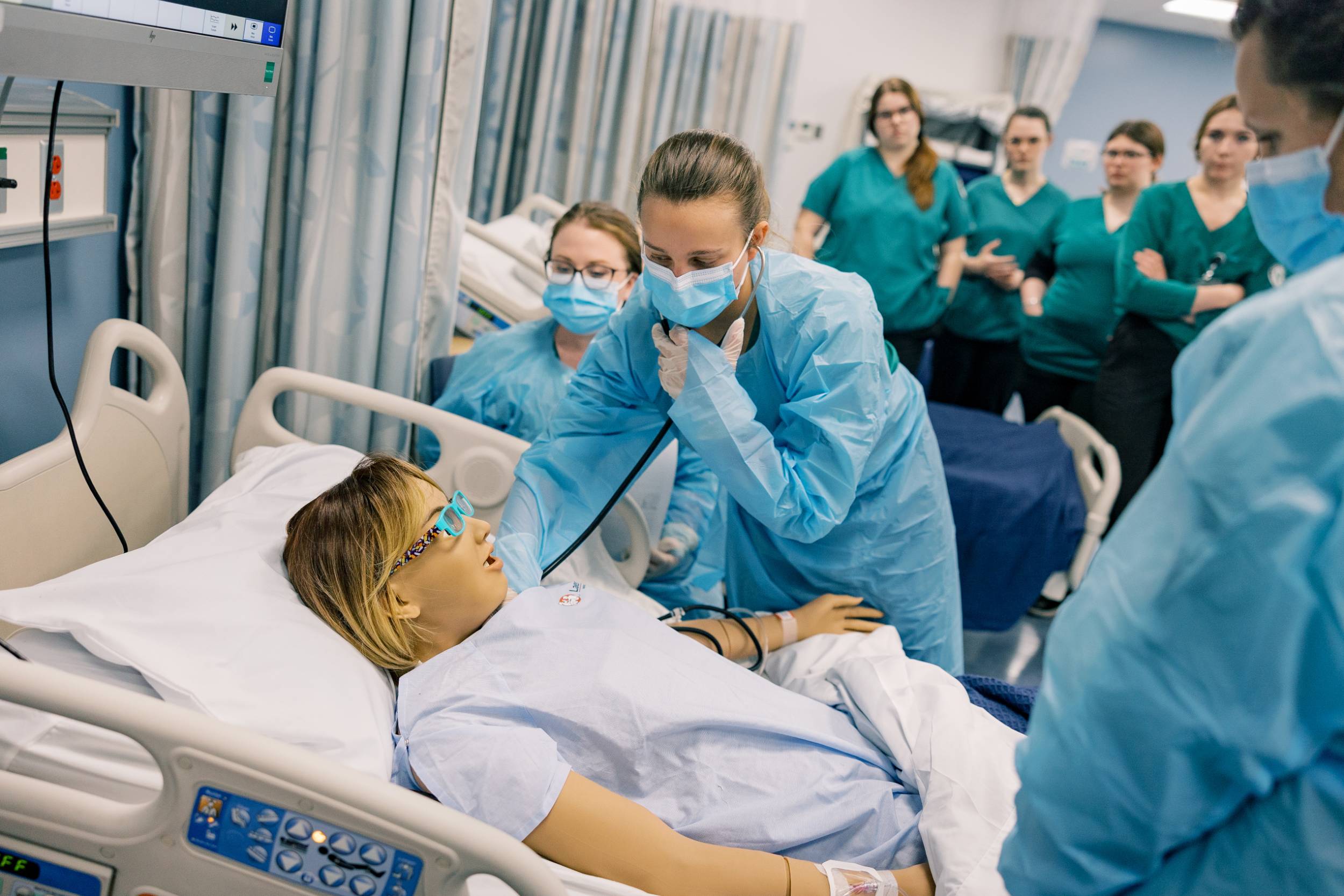 A nursing student works in one of the college's simulation labs