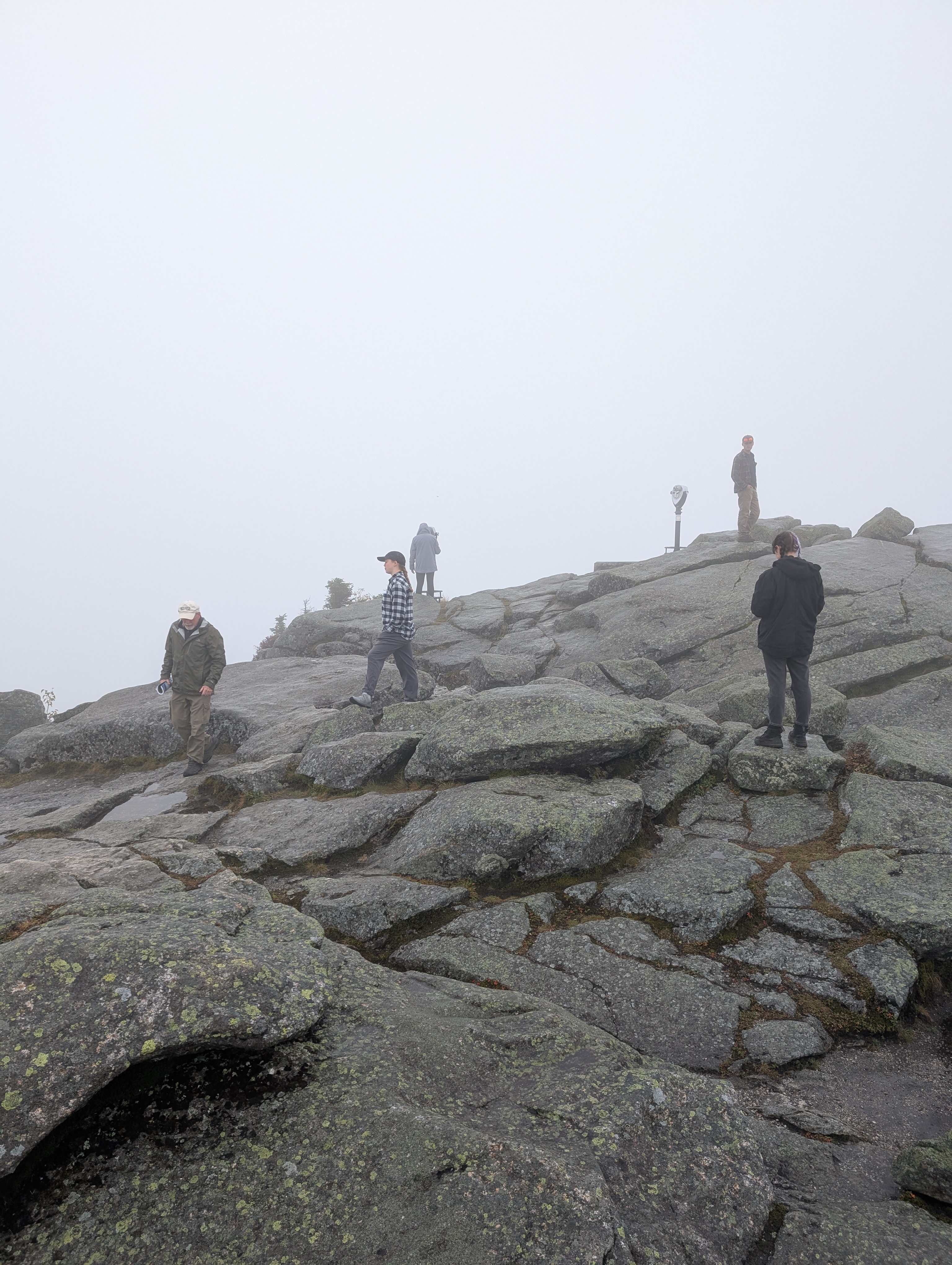Students explore a mountain summit