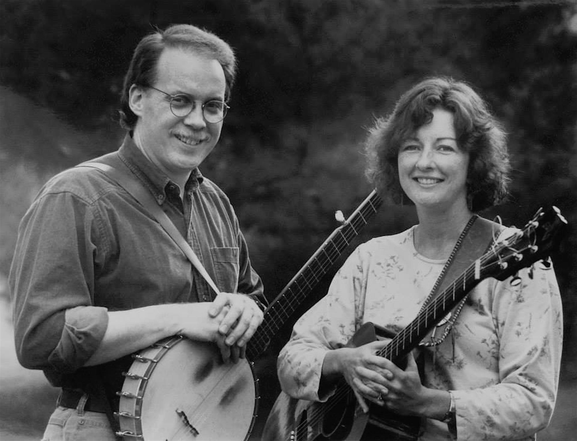 Dan Berggren and Peggy Lynn stand with their instruments