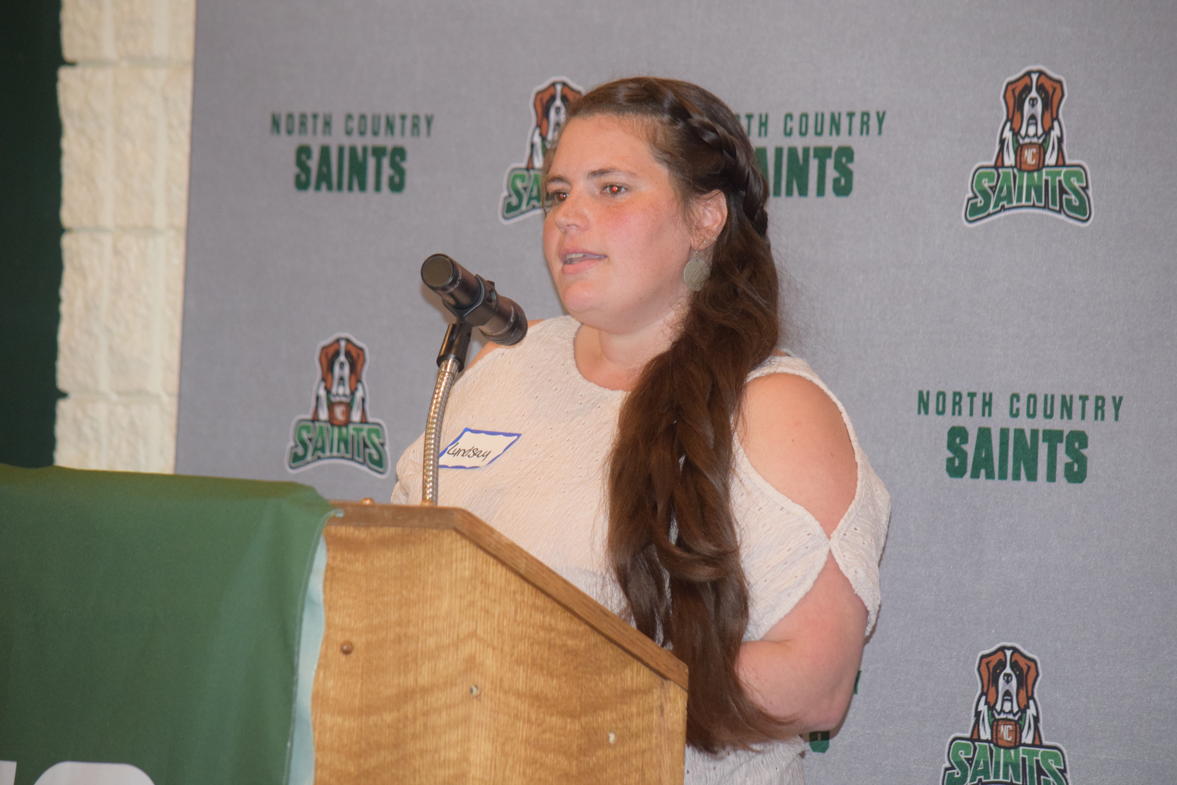 Lyndsay Stevens stands and speaks at a podium