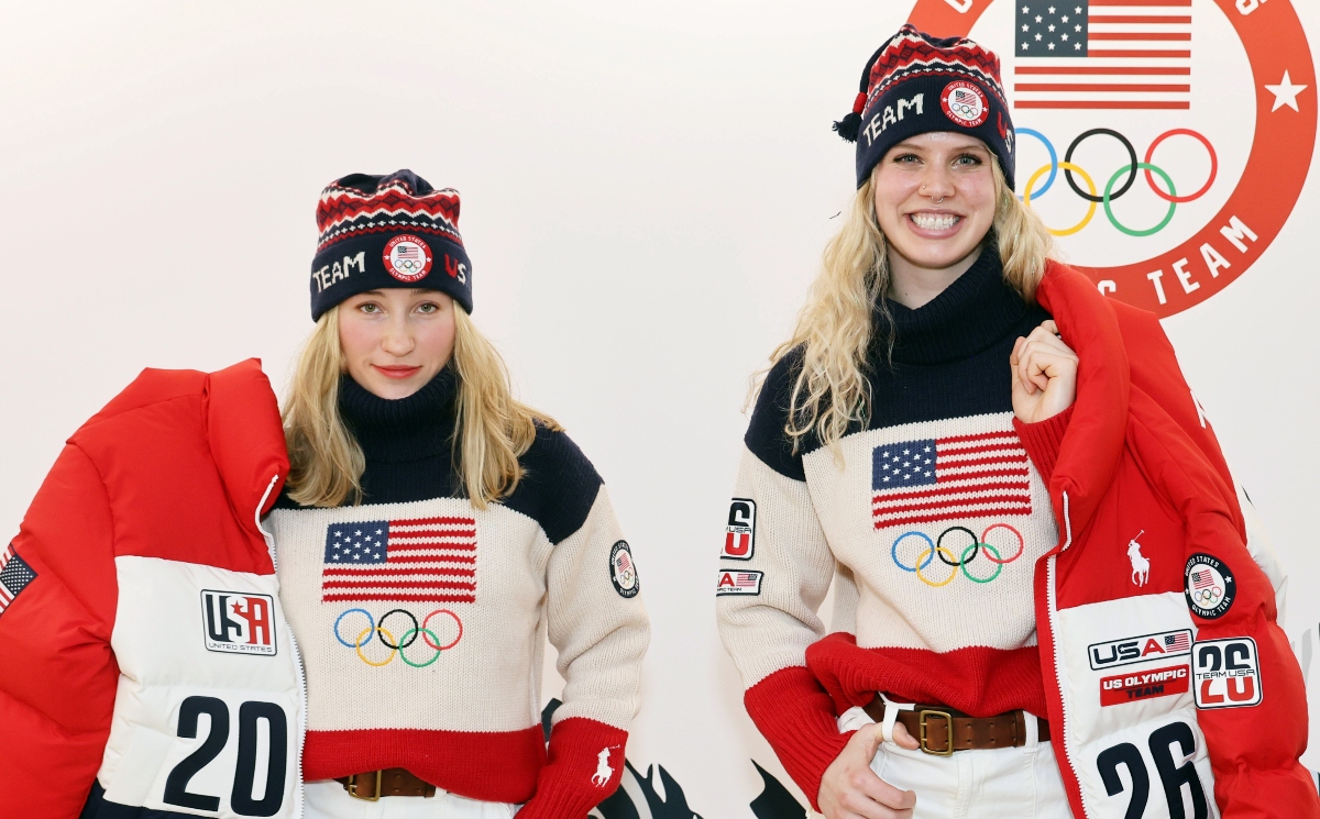 Sophia Kirkby stands and smiles at the camera with her teammate Chevonne Forgan