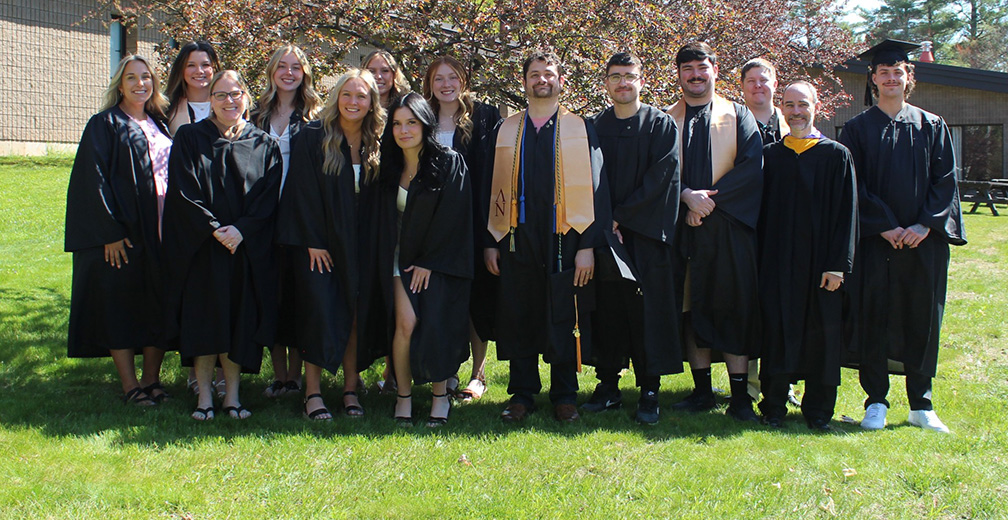 Rad Tech students pose for a 2026 Commencment photo smiling at the camera