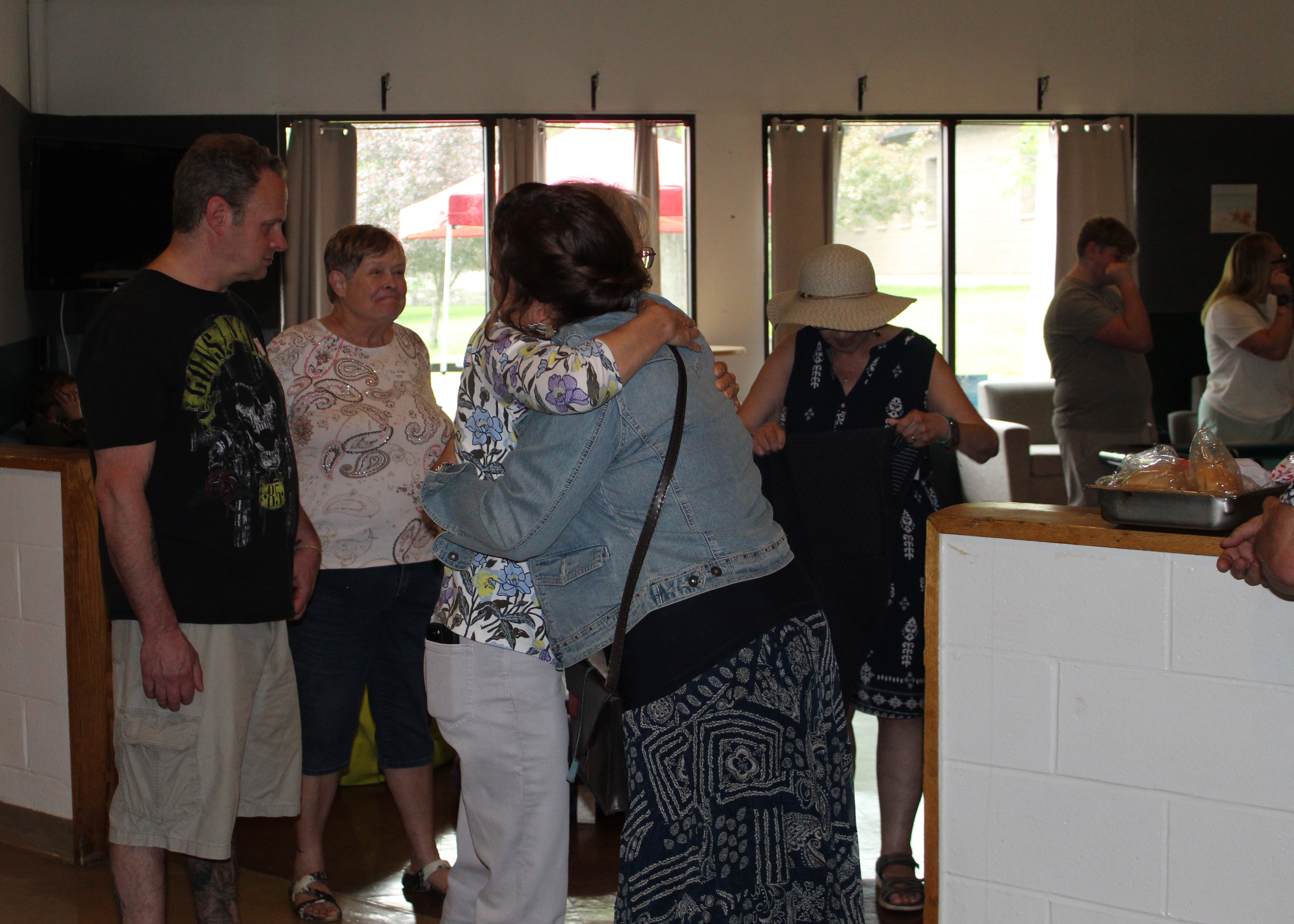 People greet eachother at a college reunion event