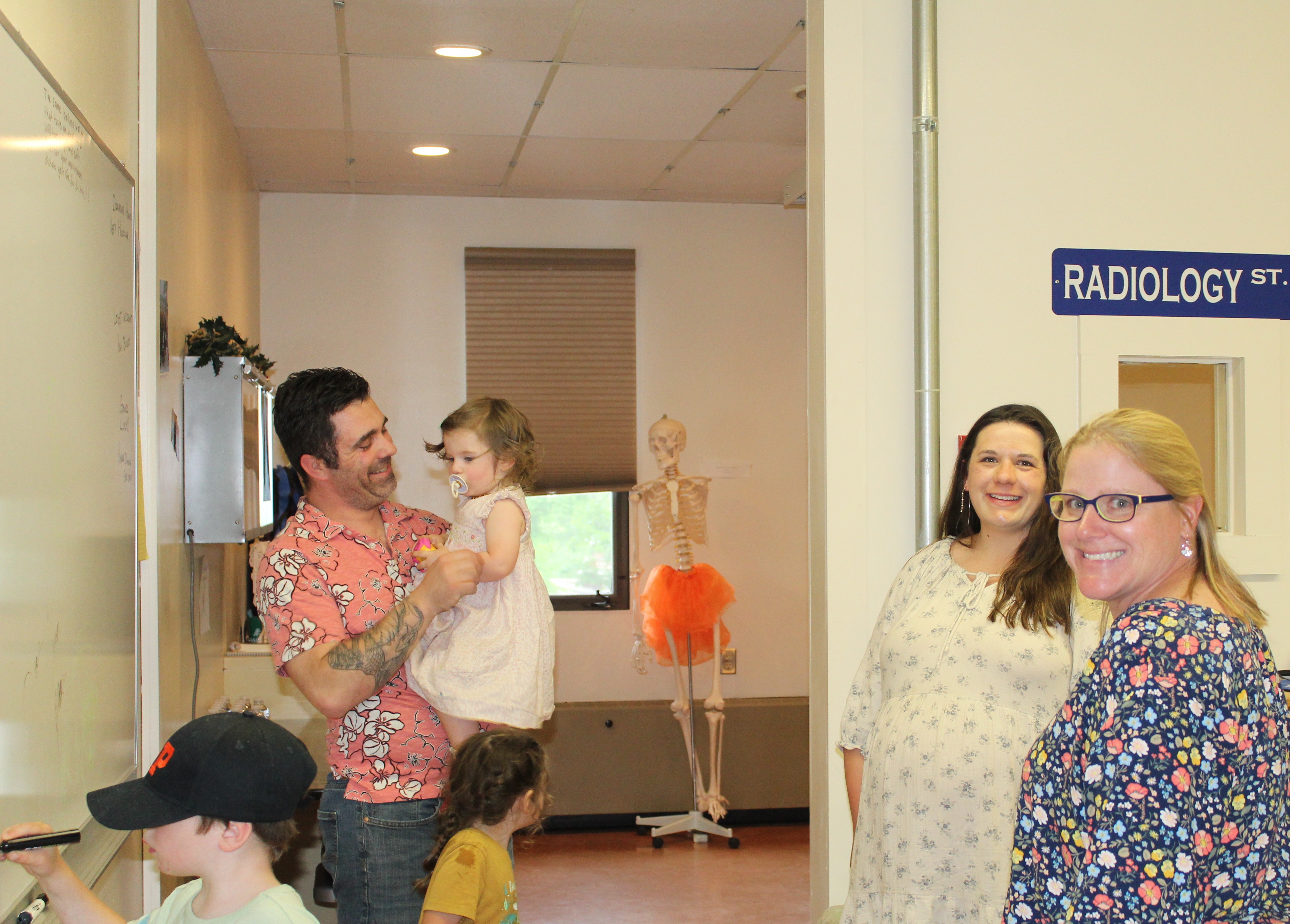 People stand inside the radiology lab at NCCC