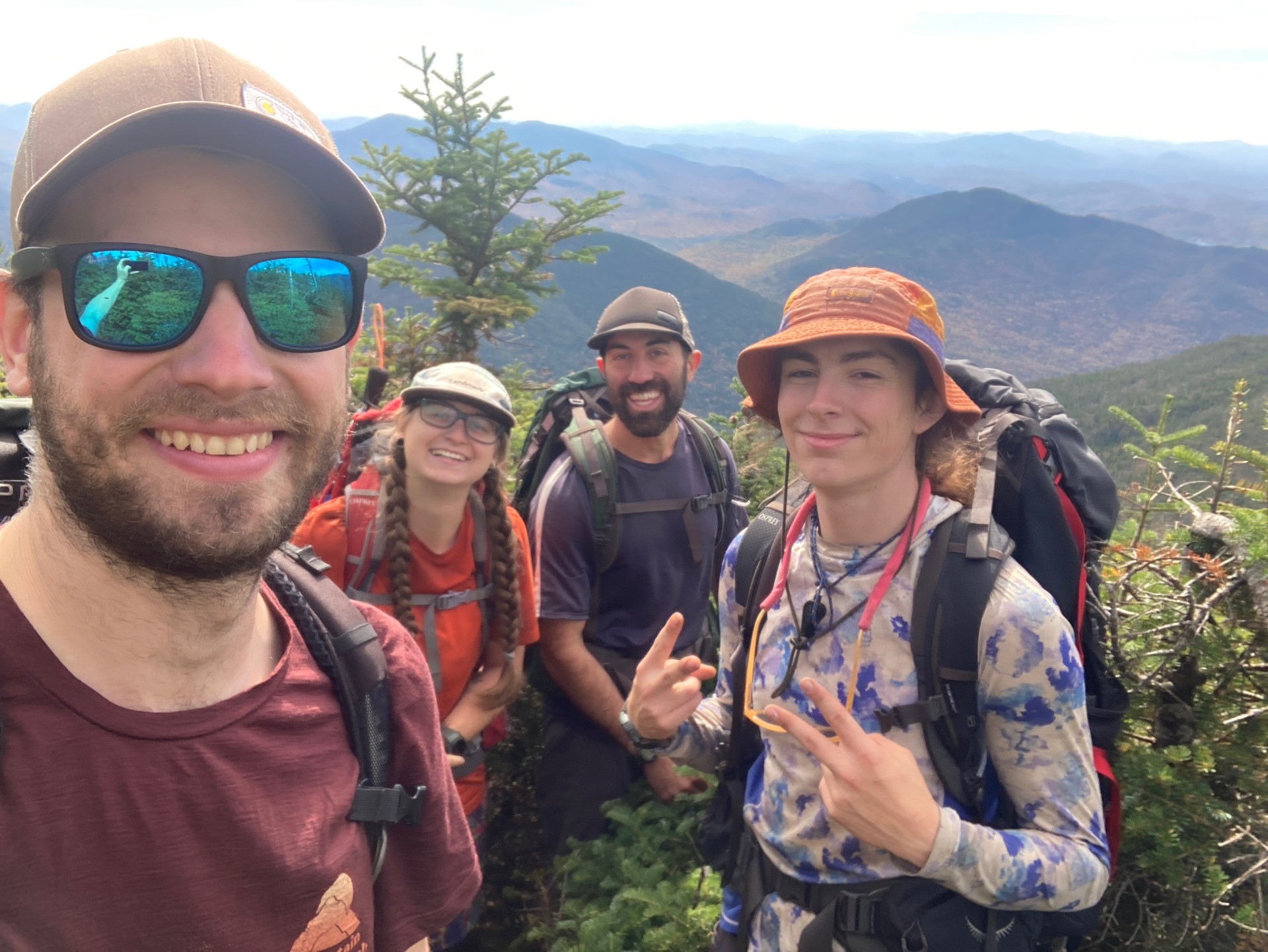 Students pose for a photo on a mountaintop