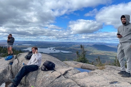 Students stand on top of Ampersand Mountain in the Adirondacks